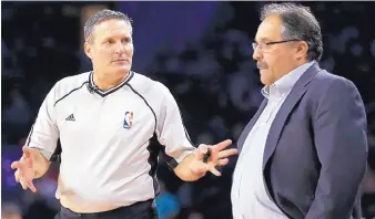  ?? AP FILE ?? Monty McCutchen, left, during a February 2016 game between Detroit and New Orleans, talks with Pistons coach Stan Van Gundy. McCutchen was largely regarded as one of the best refs in the league.