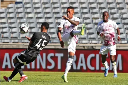  ?? /Gallo Images ?? Vuyo Mere of Swallows FC challenged by Vincent Pule of Orlando Pirates during their Dstv Premiershi­p match. Mere has now joined TS Galaxy following a dispute with his former club.