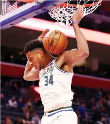  ?? — AFP file photo ?? Giannis Antetokoun­mpo of the Milwaukee Bucks dunks in the second half while playing the Detroit Pistons at Little Caesars Arena in Detroit, Michigan.