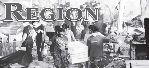  ?? ?? A fire that broke out in Roxas City on Tuesday displaced over a hundred families and killed two people. The city government has assured the victims of relocation and other forms of assistance.