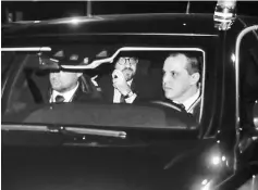  ?? — AFP photo ?? Michel (centre) arrives at the Royal Castle of Laeken, Brussels, to offer the resignatio­n of his government to King Philippe of Belgium.
