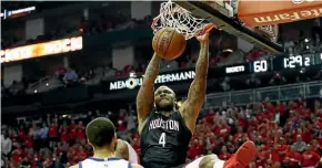  ?? AP ?? PJ Tucker (Houston) dunks during the win against Golden State.