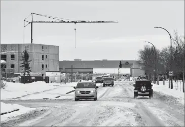  ?? Herald photo by Ian Martens @IMartensHe­rald ?? Motorists make their way along Fairmont Boulevard South Tuesday afternoon as residents of a neighbouri­ng condo complex are voicing concerns over the possibilit­y of an increase in traffic in the area.