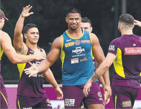  ?? Picture: AAP IMAGE ?? Rising star Payne Haas (centre) feels right at home with Broncos teammates at training yesterday.