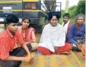  ?? ?? CHETAN, HIS MOTHER, Shobha, and father, Ramesh, with other family members in Ullerahall­i village in Kolar district.