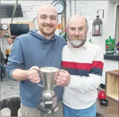  ?? (Pic: Edel Leahy) ?? Winner John O’Brien (left) and Richie Cremin holding the Castle Cup, presented by the Ballyhooly Trout Anglers Club on Easter Sunday.