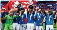  ??  ?? TROPHY: Portsmouth players at their recent Wembley triumph