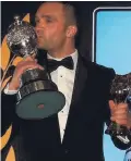  ??  ?? Lip service: Colin Turkington plants a kiss on his trophy