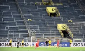  ?? Photograph: Federico Gambarini/ Getty Images ?? Borussia Dortmund playing Bayern Munich in a behind-closed-doors Bundesliga match on 26 May: a sign of things to come in the Premier League.