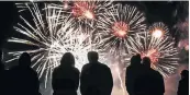  ??  ?? COLOUR BLAST: People watch as fireworks light up the sky