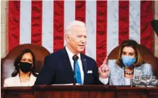  ?? MELINA MARA/THE WASHINGTON POST VIA AP, POOL ?? President Joe Biden addresses a joint session of Congress in the House Chamber at the U.S. Capitol in Washington on Wednesday, as Vice President Kamala Harris, left, and House Speaker Nancy Pelosi of Calif., look on.