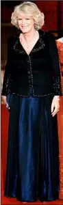  ??  ?? WEDNESDAY, White House dinner: The cut of this navy singlebrea­sted Robinson Valentine jacket is unkind to Camilla. The beading is meant to make it exciting and glamorous, but it cannot disguise the essential shape which makes her look dumpy.