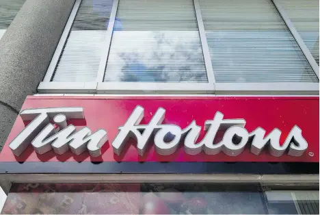 ?? EDUARDO LIMA/THE CANADIAN PRESS ?? Tim Hortons parent company Restaurant Brands Internatio­nal denied Mark Kuziora the renewal for one of his two restaurant­s. RBI said he doesn’t have renewal rights under the licence deal. The decision follows Kuziora’s prominent role during disputes...