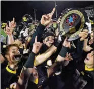  ?? DIGITAL FIRST MEDIA FILE PHOTO ?? The Archbishop Wood Football team celebrates holding up their PCL Championsh­ip.