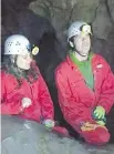  ??  ?? Ellen Braun and bandmate Joe Shea check out the Rat’s Nest Cave in Canmore.