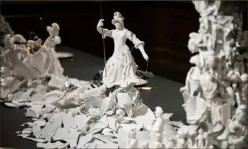  ?? Andrew Rush/Post-Gazette ?? Figures are molded and coated in sugar in “War and Pieces,” an artwork by Dutch contempora­ry artist Bouke de Vries on display at The Frick Pittsburgh.