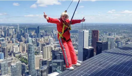  ?? EDGEWALK ?? Vicki Edney takes in the view from CN Tower’s EdgeWalk. “All of the hotels and all the different shapes of the buildings, and the colours. Fabulous!”