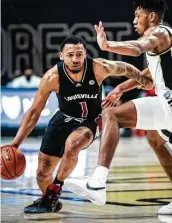  ?? Andrew Dye / Associated Press ?? Carlik Jones, left, had a season-high 23 points to help No. 16 Louisville defeat Wake Forest on Wednesday.