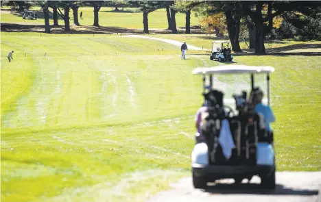  ?? RICKKINTZE­L|THE MORNING CALL ?? Golfers take their second shot as others wait on the fifth hole Wednesday at Green Pond Country Club in Bethlehem Township. The golf business is thriving like never before during the pandemic.