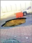  ?? Al-Shahed daily photo ?? A pothole in the middle of the road in
one of the streets.