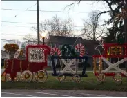  ?? LYRIC AQUINO- THE MORNING JOURNAL ?? A Holiday Train is set up and glowing at Lakeview Park as part of its annual light display. This year, the Metro Parks are hosting a new Lights at the Lake event.