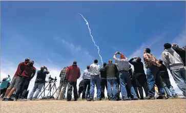  ?? Al Seib Los Angeles Times ?? SPECTATORS WATCH the rocket launch from Vandenberg Air Force Base in Santa Barbara County, a test of the U.S. Ground-based Midcourse Defense system, which has been plagued by engineerin­g problems.