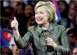  ?? — AP, AFP ?? Donald Trump waves during a primary night event in New York; Hillary Clinton speaks at her presidenti­al primary election night rally in Philadelph­ia.