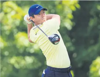  ??  ?? ABOVE
Rory McIlroy hits a shot in the first round of the BMW Championsh­ip on Thursday.