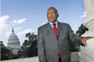  ?? AP PHOTO/LAWRENCE JACKSON ?? With the Capitol Dome in the background, U.S. Rep. John Lewis, D-Ga., poses on Capitol Hill in Washington in 2007.