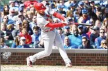  ??  ?? St Louis Cardinals’ Paul DeJong (12) hits an RBI single during the fourth inning of a baseball game against the Chicago Cubs on Sept 29, 2018 inChicago. (AP)