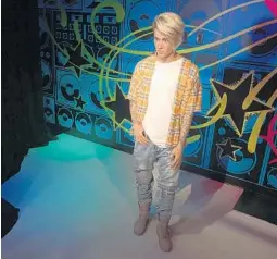  ?? DEWAYNE BEVIL/STAFF ?? Justin Bieber's new wax figure debuted Wednesday at Madame Tussauds Orlando.