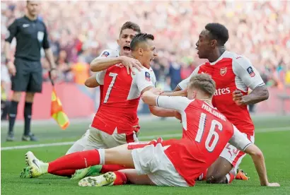  ?? AP ?? Arsenal’s Alexis Sanchez (second left) celebrates after scoring his side’s second goal agianst Manchester City. —