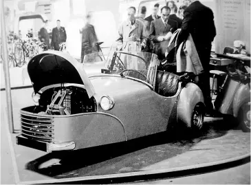  ??  ?? The Bond Minicar, powered by a tiny 122cc Villiers two-stroke engine and three-speed gearbox, aroused much curiosity at the 1949 Earls Court Show.