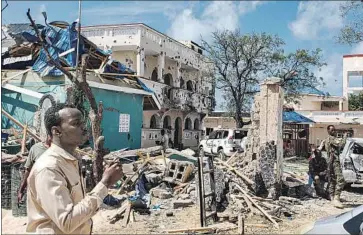  ?? AFP/Getty Images ?? THE ASASEY HOTEL in Kismayo was hit by a suicide bomb and gunmen with the Shabab militant group.