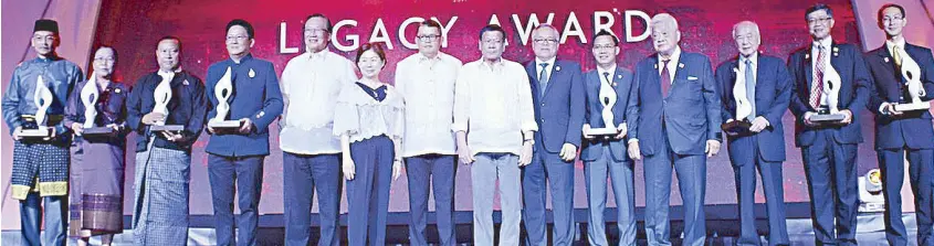  ??  ?? The Legacy Awardees from ASEAN: (from left) Haji Musa Bin Hj Adnin from Brunei, Rattana Prathoumva­n from Laos, Aung Ko Win from Myanmar, Dr. (H.C.) Sudhamek AWS from Indonesia, ASEAN-BAC Philippine­s members George Barcelon and Tessie Sy-Coson, chair...