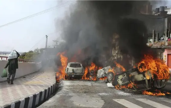  ?? (AP) ?? Cars set on fire in Jammu, India, to protest against a suicide bomb attack