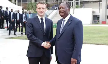  ??  ?? French president Emmanuel Macron (left) and Ivorian president Alassane Ouattara announced the launch of the Eco