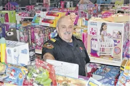  ?? DIANE CROCKER ?? Former Corner Brook firefighte­r Gord Hamlyn is surrounded by toys at the storage facility used by the Corner Brook Firefighte­rs’ Toy Drive in this file image from a previous year. The storage facility was broken into recently and between $3,000 and $4,000 worth of toys was destroyed.