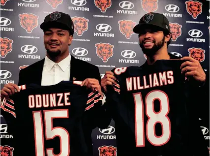  ?? DAVID BANKS/USA TODAY SPORTS ?? Bears first-round draft choices Rome Odunze and Caleb Williams pose for photos at a news conference at Halas Hall on April 26 in Lake Forest, Ill.