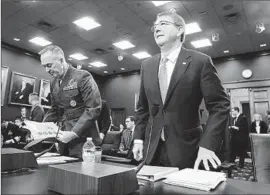  ?? Mark Wilson
Getty I mages ?? DEFENSE Secretary Ashton Carter, right, said the U. S. goal is to overload militants’ networks and “interrupt their ability to command and control forces.”