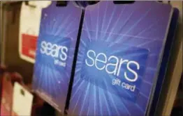  ?? SETH WENIG — THE ASSOCIATED PRESS ?? Sears gift cards are displayed at a store in Hackensack, N.J., Monday. Sears filed for Chapter 11 bankruptcy protection Monday, buckling under its massive debt load and staggering losses.