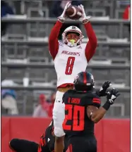  ?? (Arkansas Democrat-Gazette/Thomas Metthe) ?? South Alabama wide receiver Jalen Tolbert (8) pulls in a pass over Arkansas State defensive backs Booker Ficklin and Detravion Green (20) during the third quarter Saturday. Tolbert caught 10 passes for 252 yards and 3 touchdowns, including the go-ahead score in the fourth quarter to help the Jaguars win 38-31. More photos at www.arkansason­line.com/1129asusa/