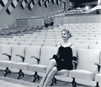  ?? Photo: FAIRFAX NZ ?? New Zealand actress Ngaire Porter enjoys the brand-new 100-seat Regent cinema
in Naenae, Lower Hutt,
in 1958.