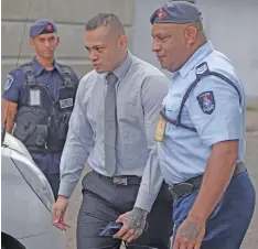  ?? Photo: Ronald Kumar ?? Jone Vakarisi is escorted by Police outside court on May 20, 2020.