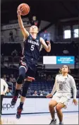  ?? Michael Conroy / Associated Press ?? UConn’s Paige Bueckers (5) gets a basket on a fast break against Butler on Saturday.