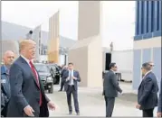  ?? K.C. ALFRED/SAN DIEGO UNION-TRIBUNE ?? President Donald Trump takes a tour of his border wall prototypes in San Diego County last March.