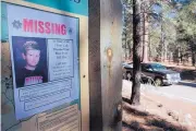  ?? SHAUN STANLEY/THE DURANGO HERALD ?? A missing poster of 13-year-old Dylan Redwine hangs on a trail head sign next to Vallecito Reservoir in Vallecito, Colo., in 2012.