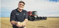  ?? PHOTO SUPPLIED ?? Bumper crop . . . Wakanui farmer Eric Watson inspects his world record wheat crop, before harvesting.