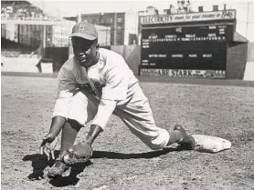  ?? HULTON ARCHIVE/GETTY ?? Jackie Robinson broke baseball’s color barrier in 1947 with the Brooklyn Dodgers. By the end of Robinson’s career, he had won an MVP award and a World Series title, was named Rookie of the Year and was the 1949 batting champion.