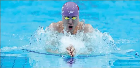  ?? PHOTOS BY XINHUA ?? Qin Haiyang will be one of China’s biggest medal hopes in the Paris Olympics pool following a stellar 2023 during which he broke the men’s 200m breaststro­ke world record.